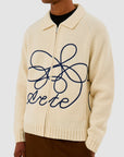 Pull en maille avec logo en fleuri